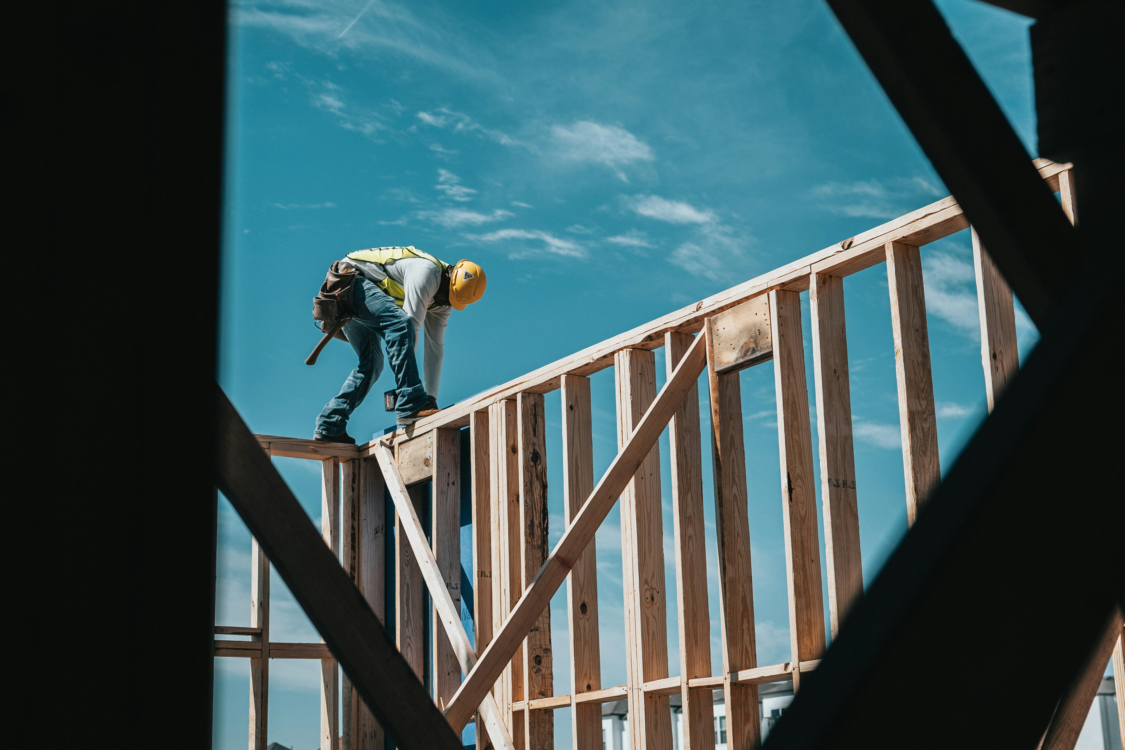 Construction worker framing a building